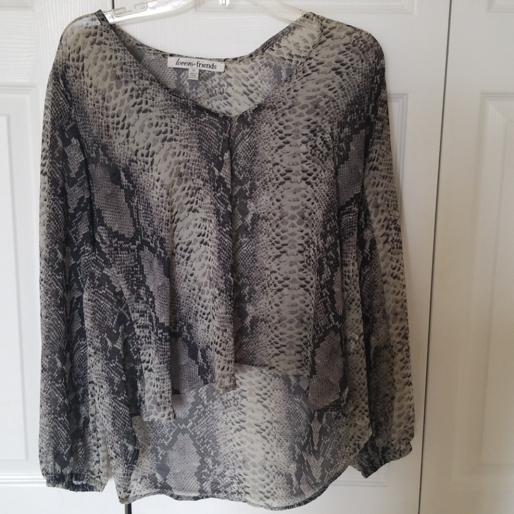 Hi low flowy see through shirt.
